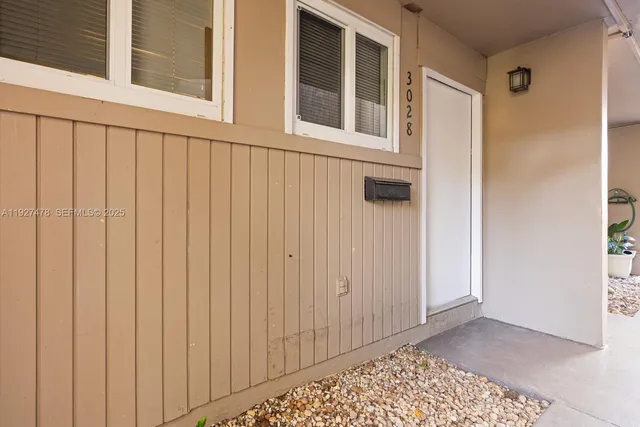 a view of a door and a window
