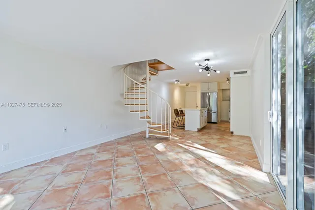 a view of a livingroom with a patio and a yard