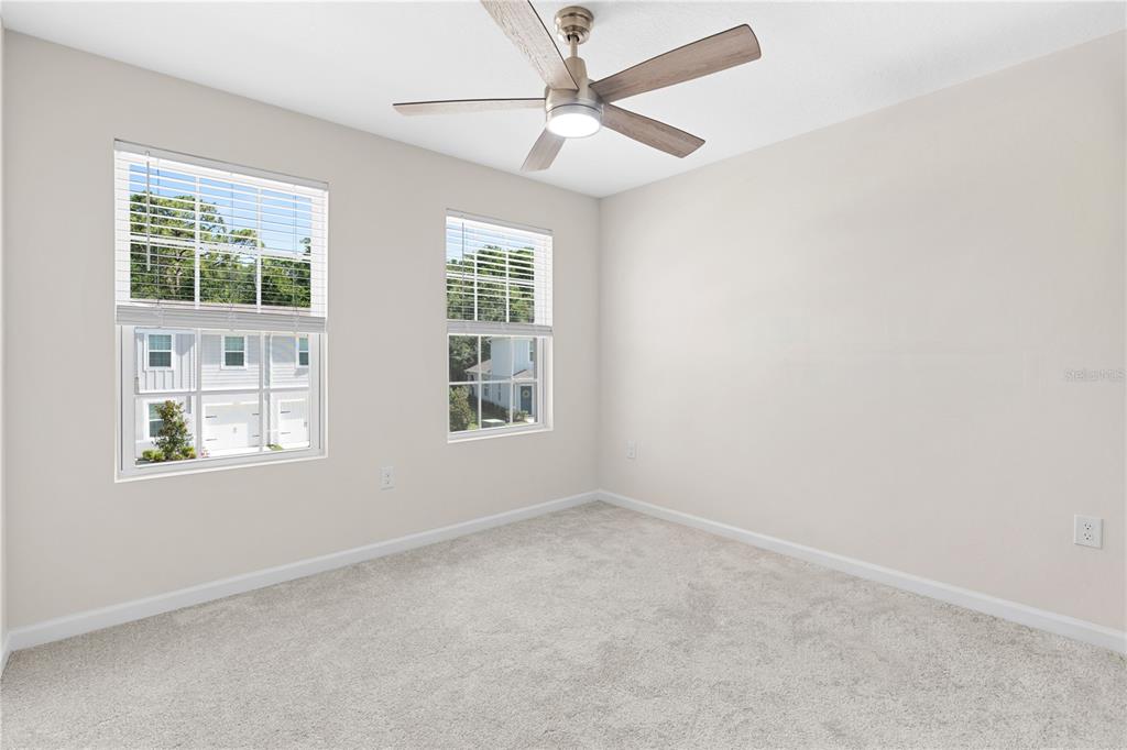 12003 Grizzly Lane New Port Richey, FL 34654 - Photo 25 of 43 an empty room with a window and a fan