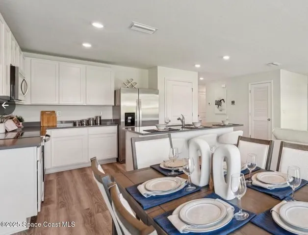 a kitchen with a sink stove and refrigerator