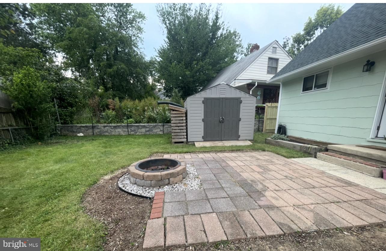 5700 Stillwell Road Rockville, MD 20851 - Photo 4 of 19 a backyard of a house with barbeque oven