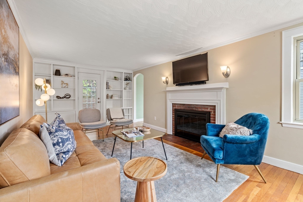 31 Northbourne Road Boston, MA 02130 - Photo 1 of 34 a living room with furniture a flat screen tv and a fireplace