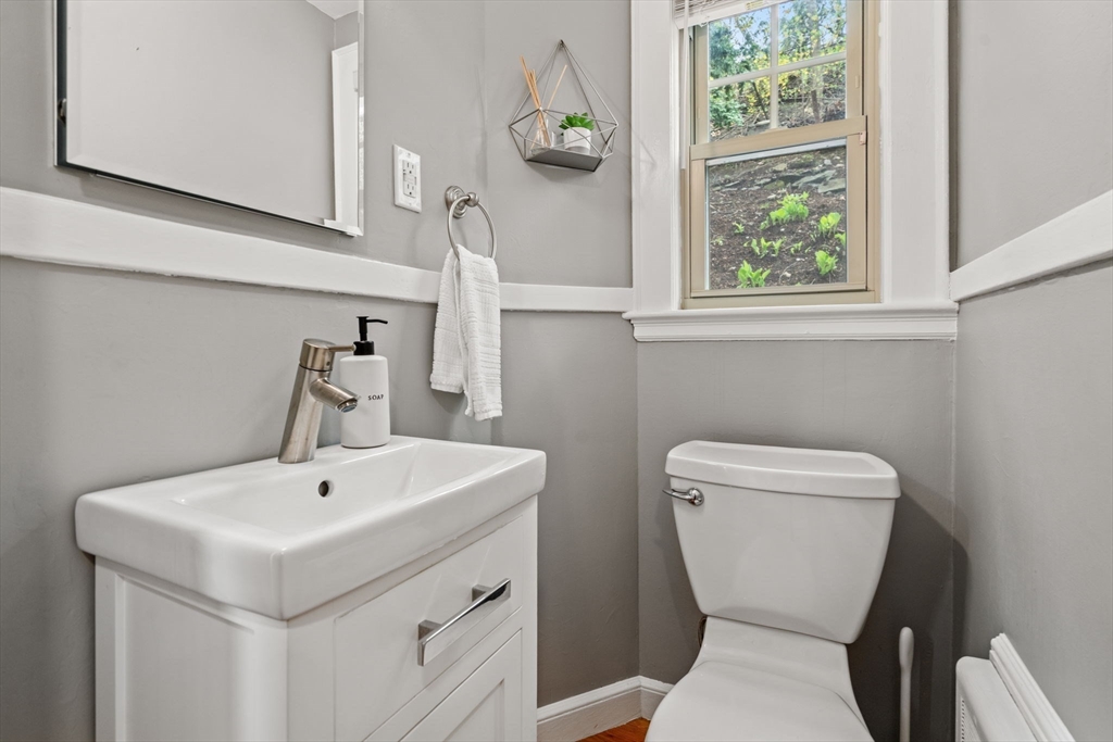 31 Northbourne Road Boston, MA 02130 - Photo 12 of 34 a white toilet sitting next to a bathroom sink