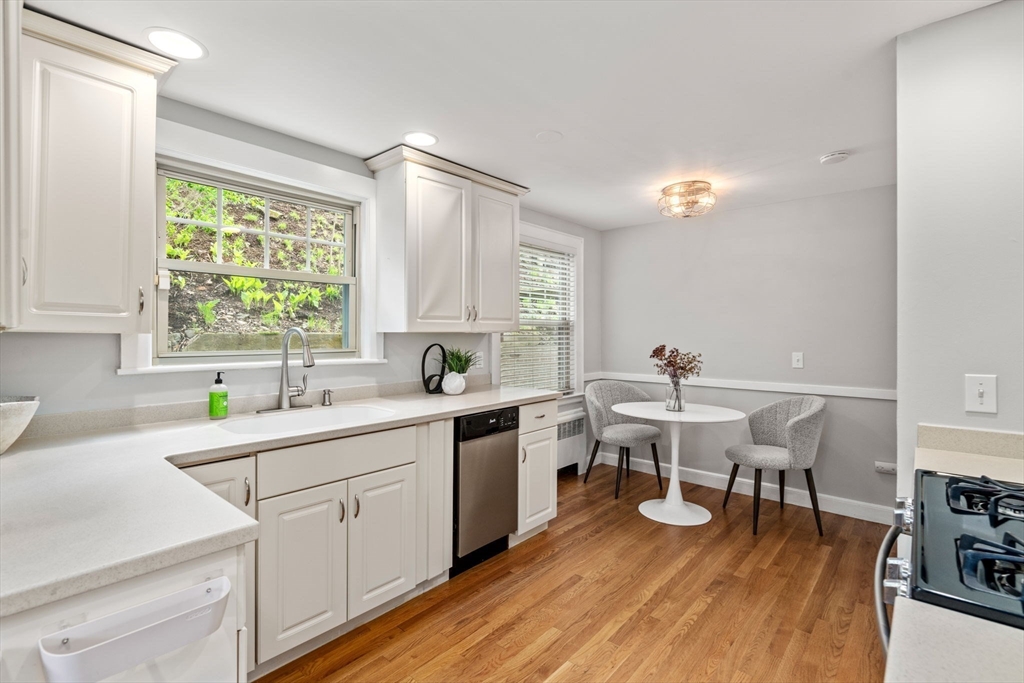 31 Northbourne Road Boston, MA 02130 - Photo 15 of 34 a kitchen with a sink cabinets and wooden floor