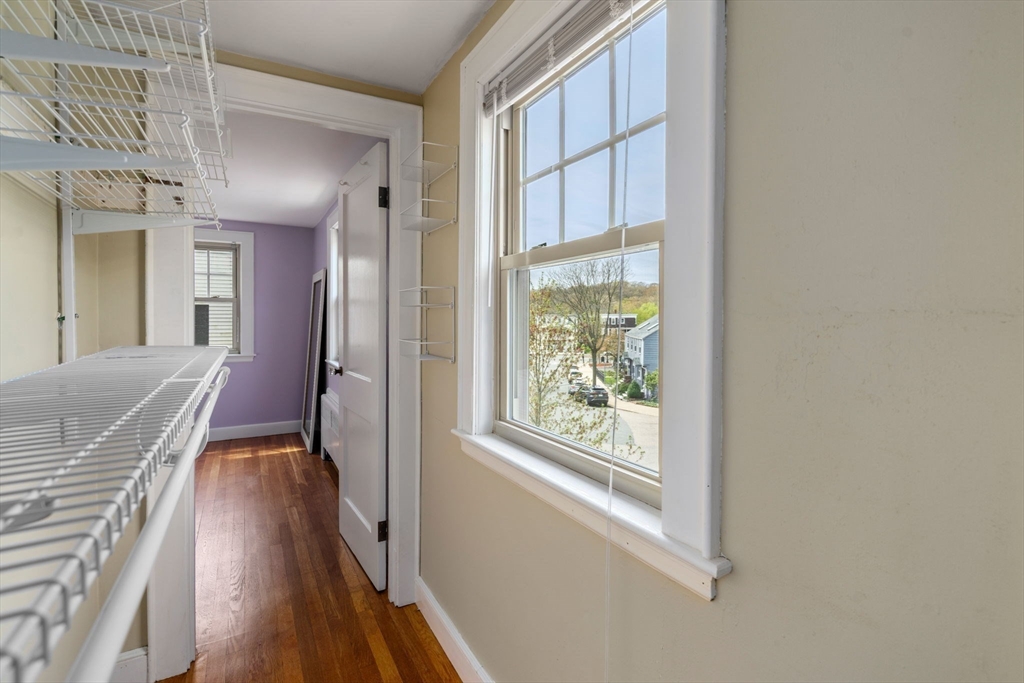 31 Northbourne Road Boston, MA 02130 - Photo 19 of 34 a view of a hallway with wooden floor and staircase
