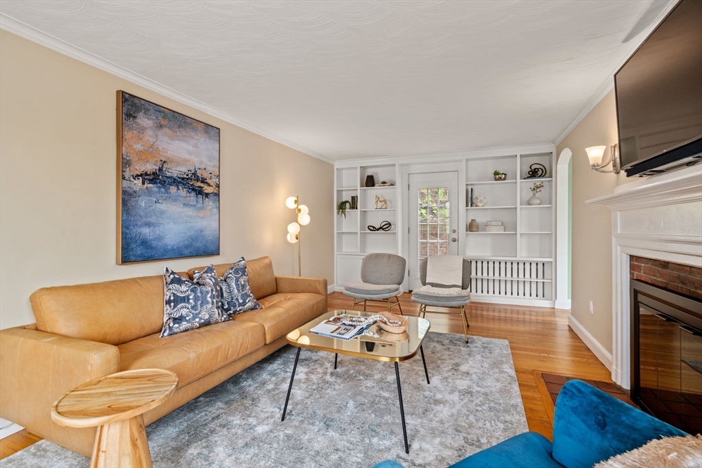 31 Northbourne Road Boston, MA 02130 - Photo 2 of 34 a living room with furniture and a fireplace