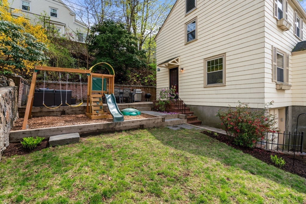 31 Northbourne Road Boston, MA 02130 - Photo 25 of 34 a view of a house with backyard and sitting area