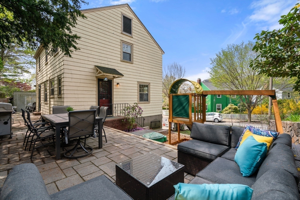 31 Northbourne Road Boston, MA 02130 - Photo 27 of 34 a outdoor space with patio the couches and a dining table with the garden view