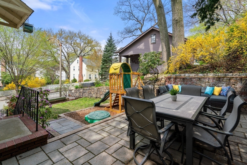 31 Northbourne Road Boston, MA 02130 - Photo 28 of 34 a view of a chairs and table in backyard of the house