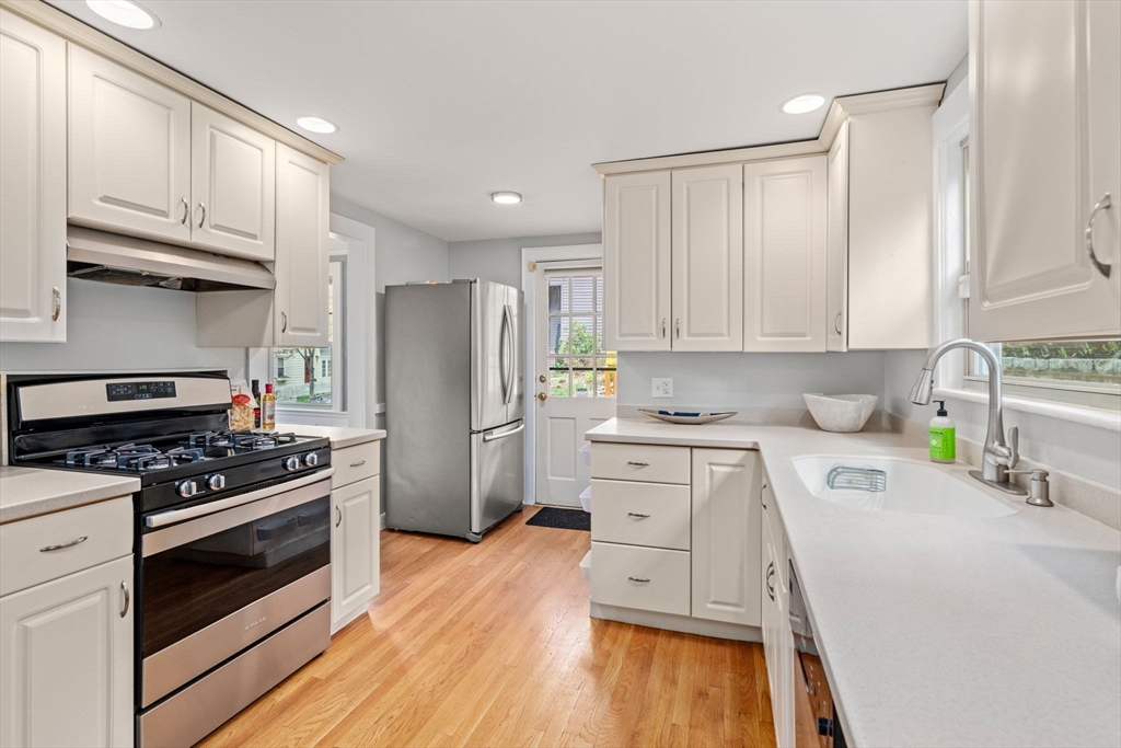 31 Northbourne Road Boston, MA 02130 - Photo 6 of 34 a kitchen with wooden cabinets and stainless steel appliances