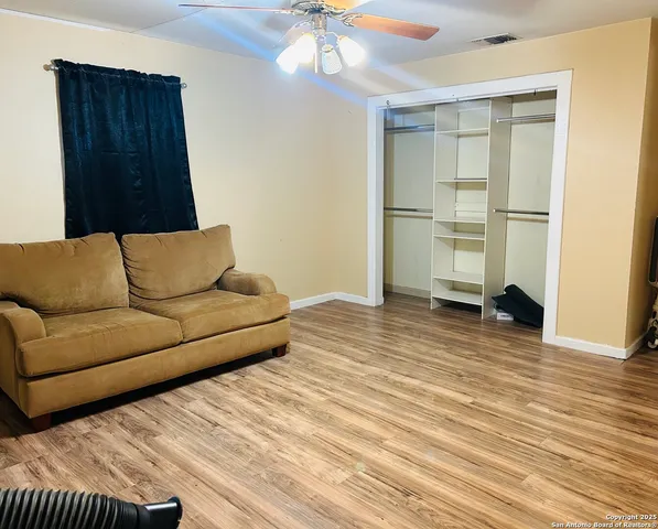 a bed room with a bed and a chair