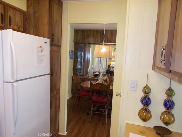 a white refrigerator freezer sitting inside of a kitchen