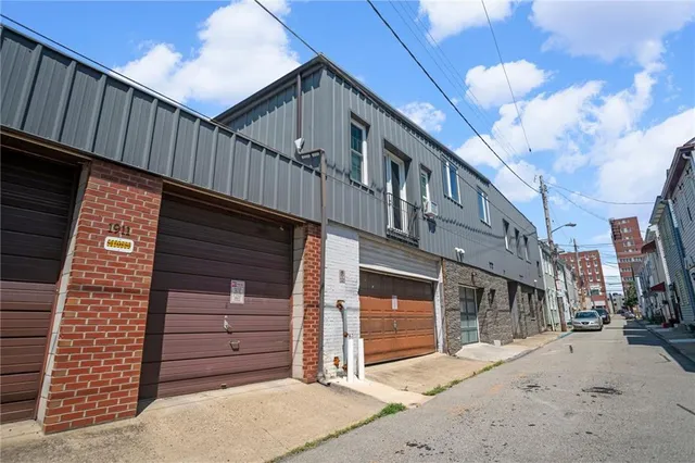 a front view of a house with a garage