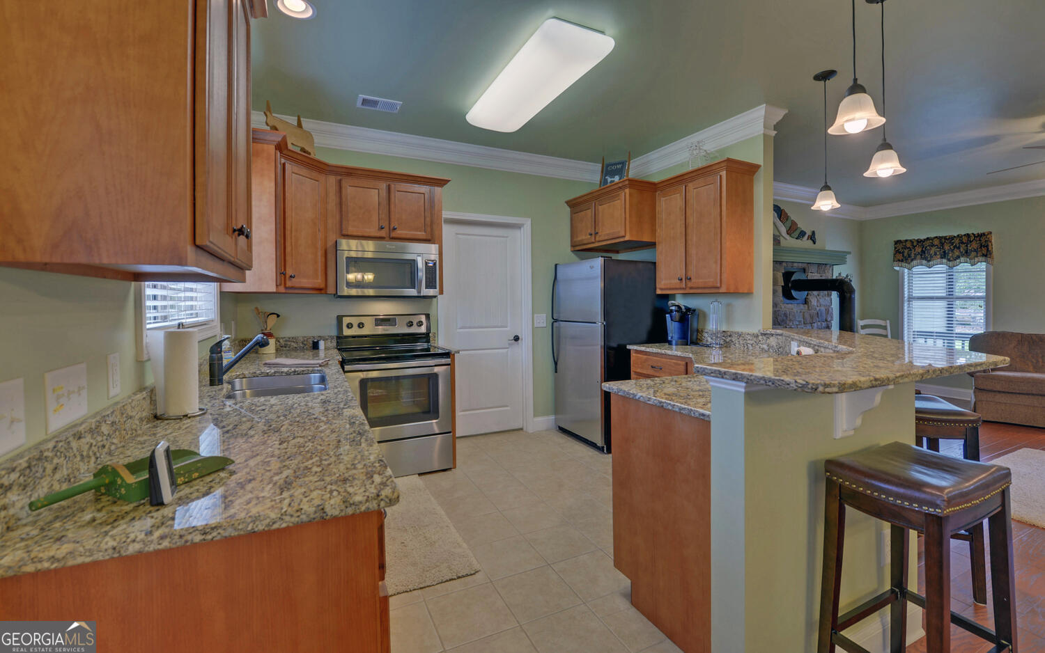 60 Villa Courts Hartwell, GA 30643 - Photo 12 of 47 a kitchen with stainless steel appliances granite countertop a stove refrigerator and a sink