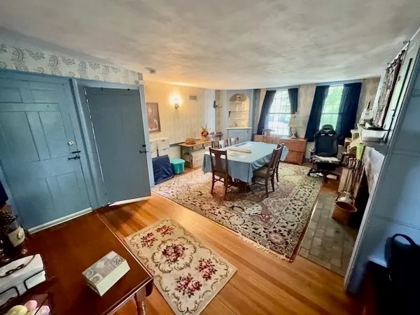 a view of a living room and dining room