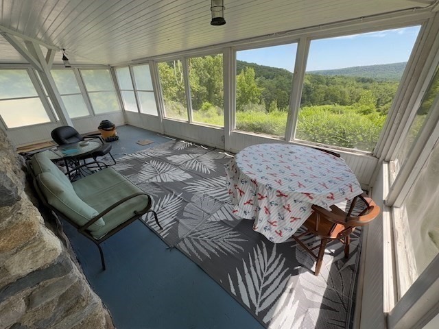 604 Main Road Granville, MA 01034 - Photo 27 of 36 a living room with furniture and a large window