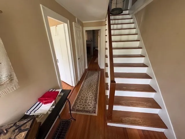 a white toilet sitting next to a sink