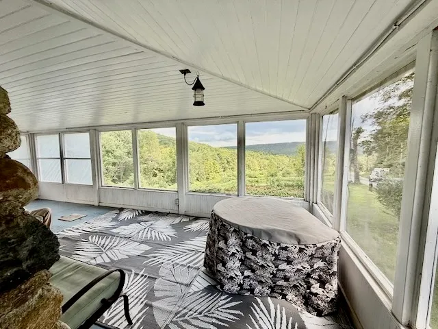 a large bedroom with a large bed and a large window