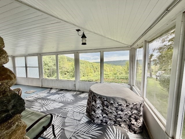 604 Main Road Granville, MA 01034 - Photo 4 of 36 a large bedroom with a large bed and a large window