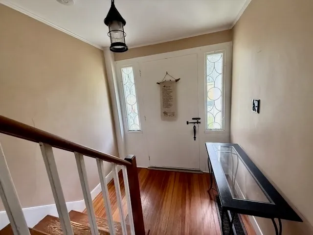 a view of entryway with wooden floor