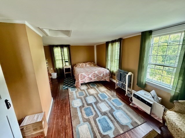 604 Main Road Granville, MA 01034 - Photo 7 of 36 a bedroom with a bed and wooden floor