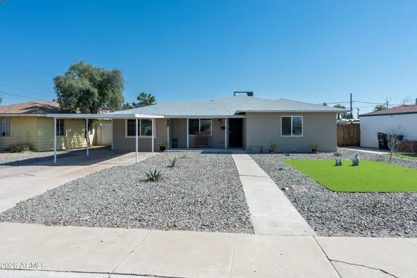 front view of a house with a yard