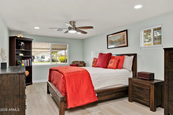 a bedroom with a bed and dresser