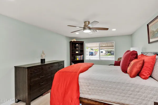 a bedroom with a large bed and a window