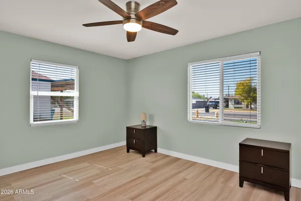 a view of room with window and ceiling fan