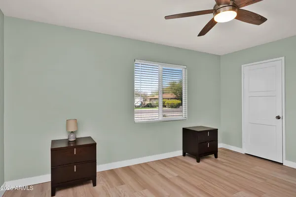 a living room with a bed and a window