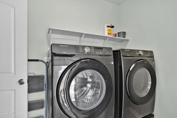 a utility room with dryer and washer