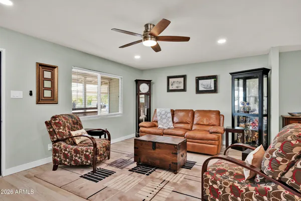 a living room with furniture and a window