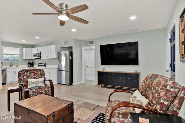 a living room with furniture and a flat screen tv