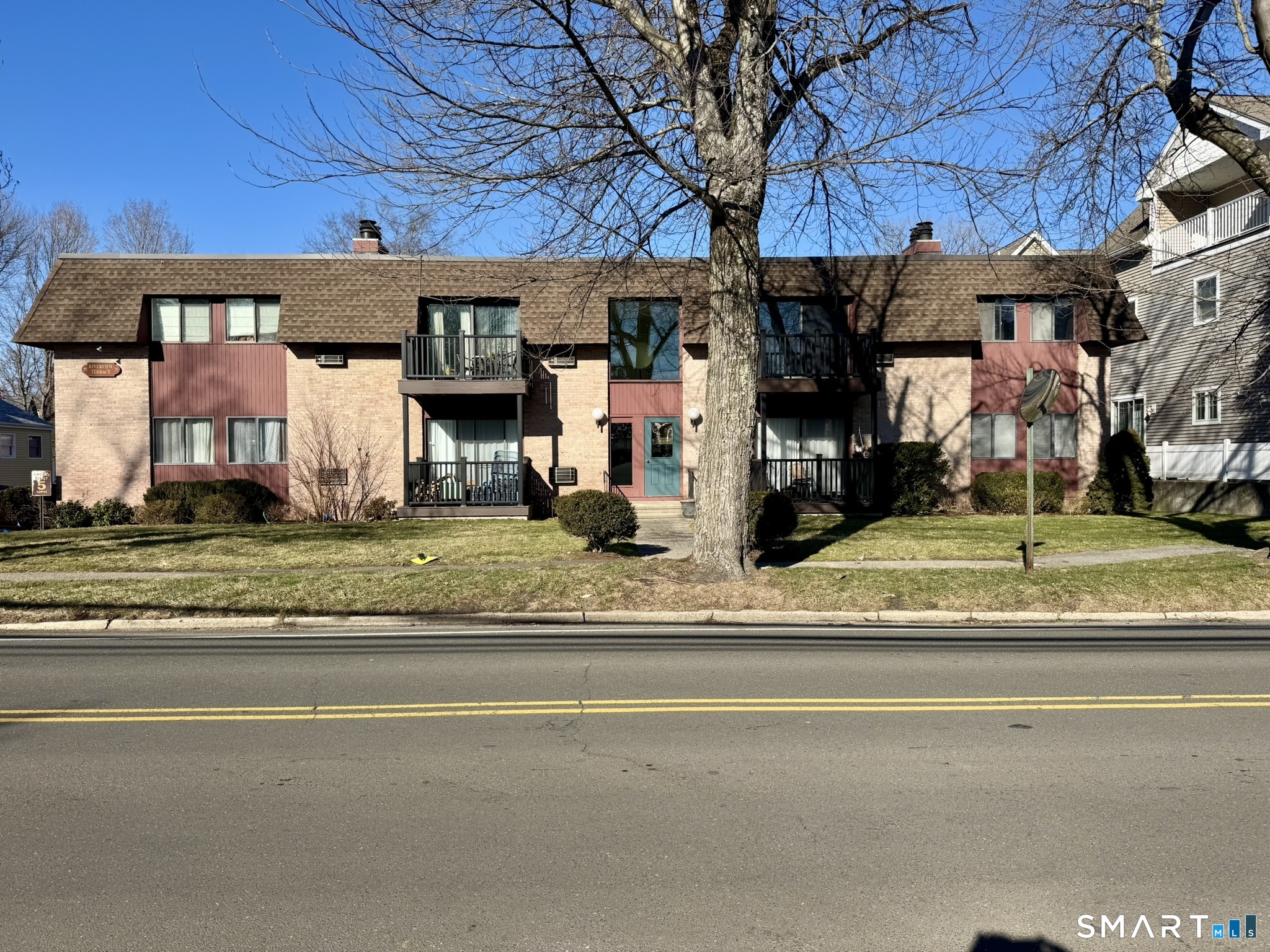 76 Maple Tree Avenue, Unit 6 Stamford, CT 06906 - Photo 1 of 27 a view of a house with a outdoor space