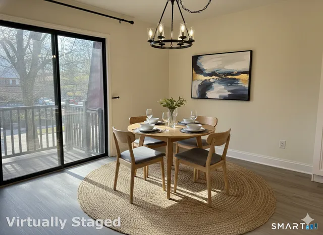 a view of a room with wooden floor and a window