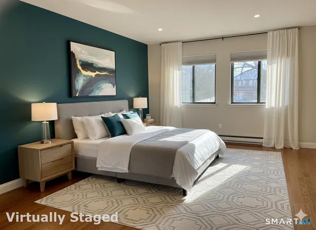 a view of a room with wooden floor and fan