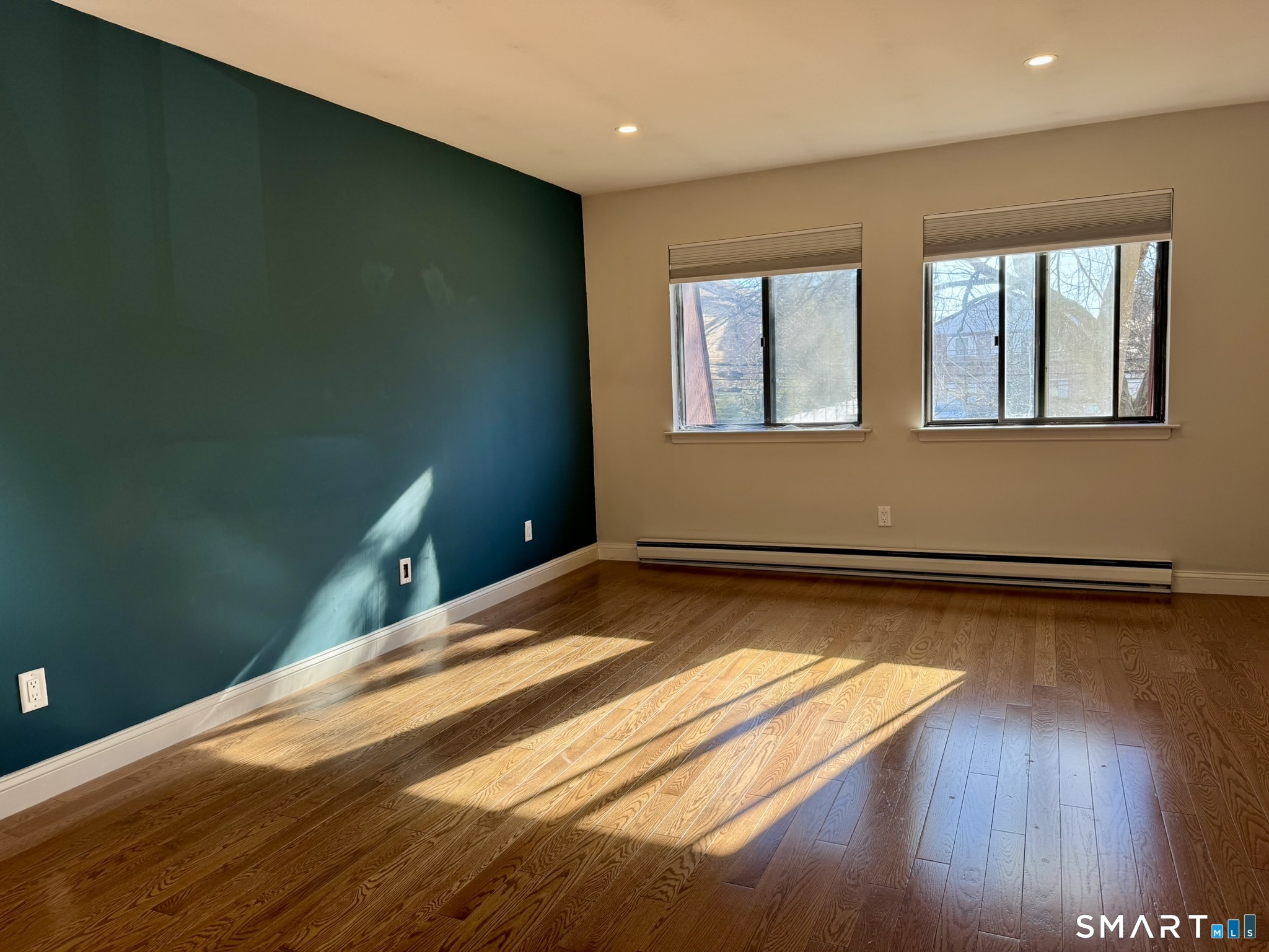 76 Maple Tree Avenue, Unit 6 Stamford, CT 06906 - Photo 14 of 27 a view of a room with wooden floor and fan