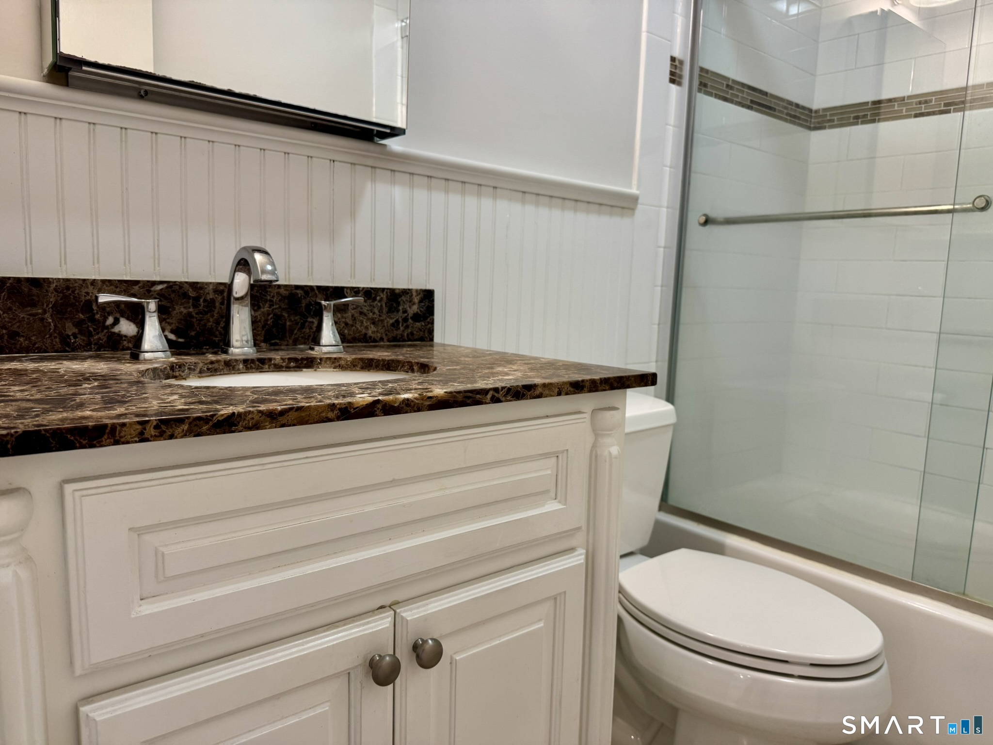 76 Maple Tree Avenue, Unit 6 Stamford, CT 06906 - Photo 17 of 27 a bathroom with a granite countertop sink toilet and shower
