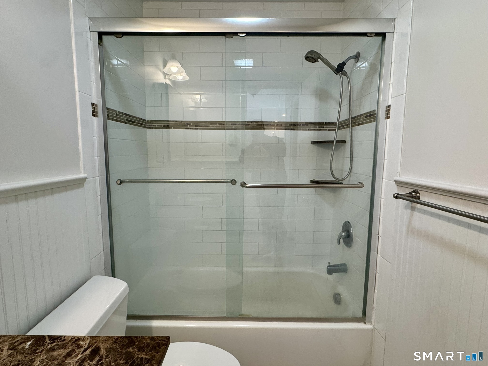 76 Maple Tree Avenue, Unit 6 Stamford, CT 06906 - Photo 18 of 27 a bathroom with a shower and toilet