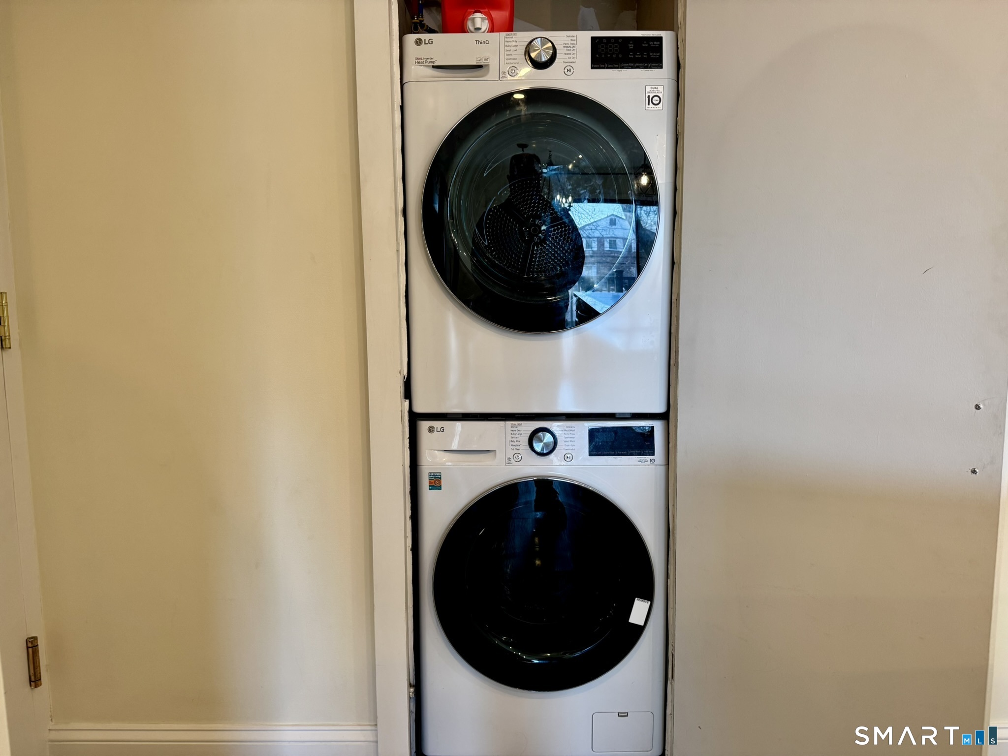 76 Maple Tree Avenue, Unit 6 Stamford, CT 06906 - Photo 19 of 27 a close up view of a washer and dryer