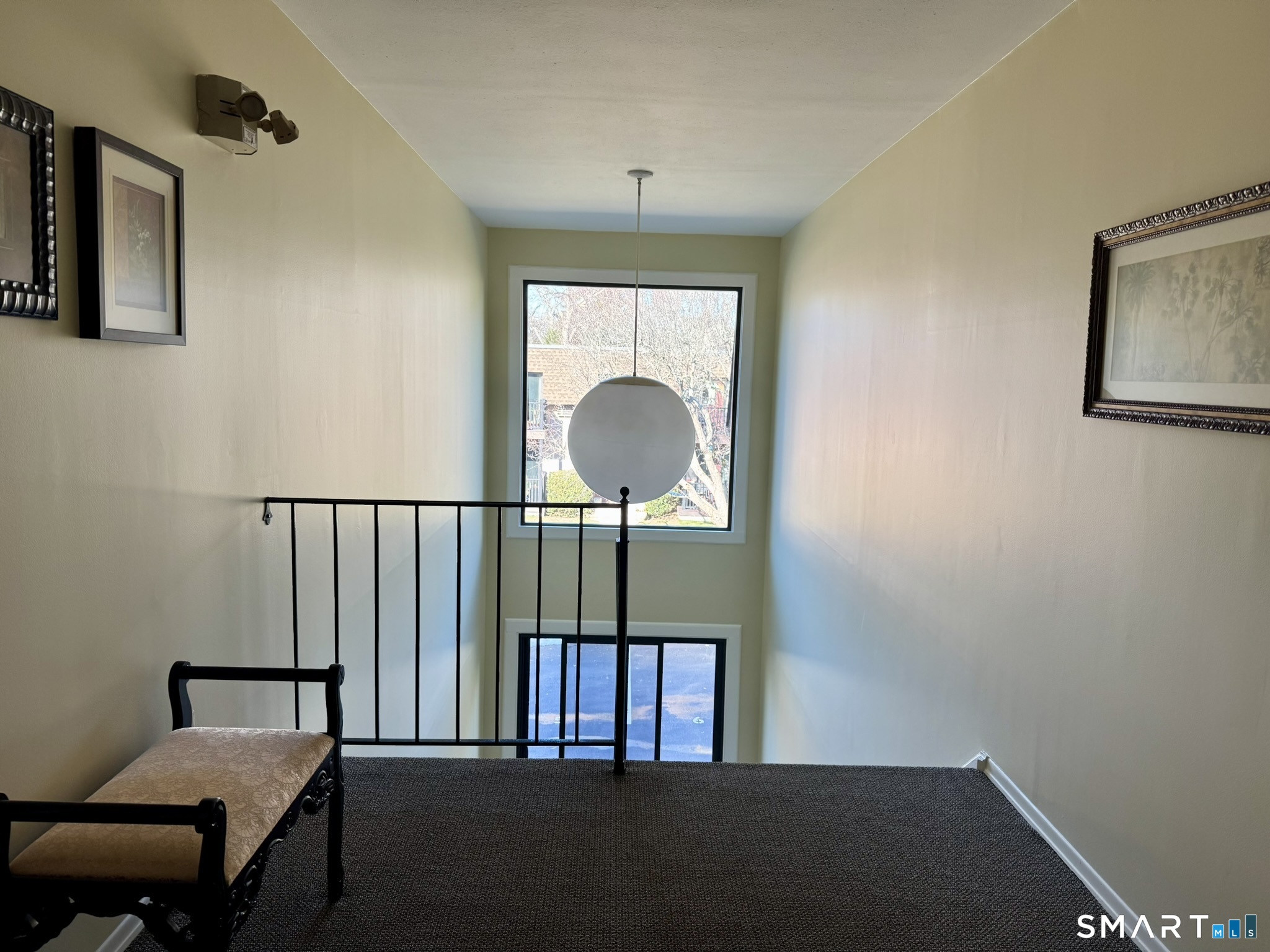 76 Maple Tree Avenue, Unit 6 Stamford, CT 06906 - Photo 2 of 27 a view of a hallway with a window