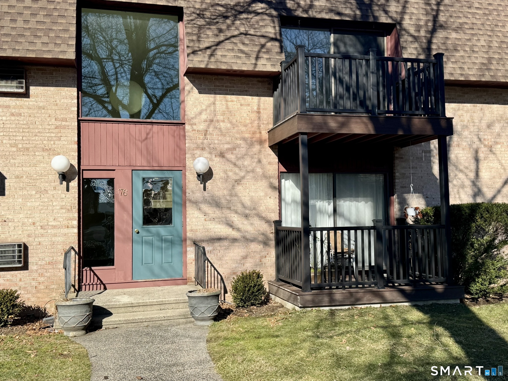 76 Maple Tree Avenue, Unit 6 Stamford, CT 06906 - Photo 26 of 27 a view of front door of house with yard