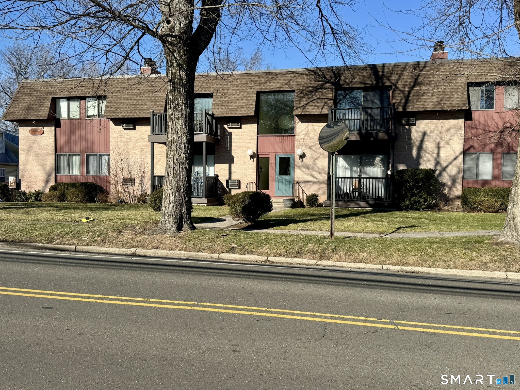 76 Maple Tree Avenue, Unit 6 Stamford, CT 06906 - Photo 27 of 27 a view of a house with a backyard