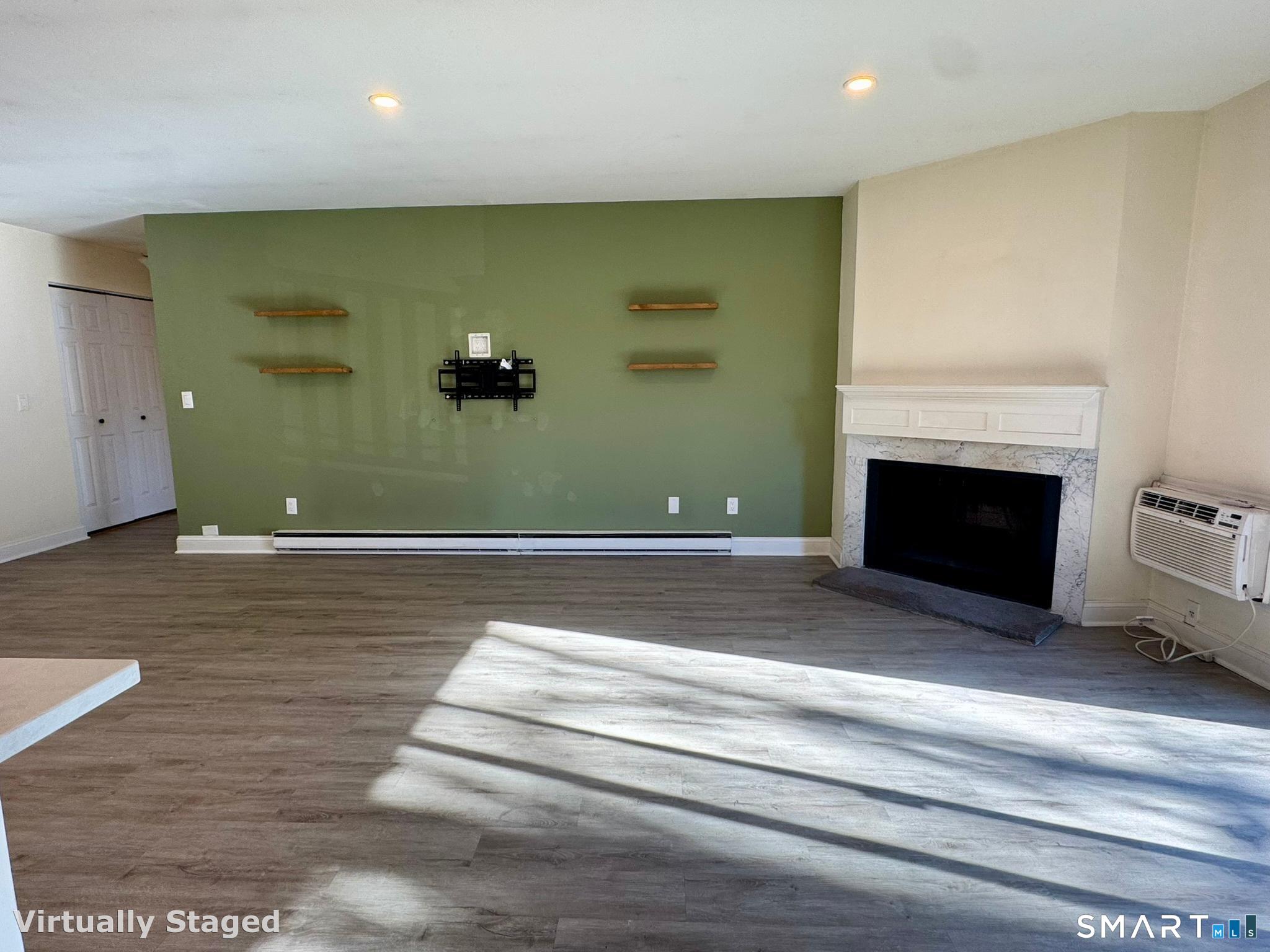 76 Maple Tree Avenue, Unit 6 Stamford, CT 06906 - Photo 9 of 27 a view of a livingroom with wooden floor