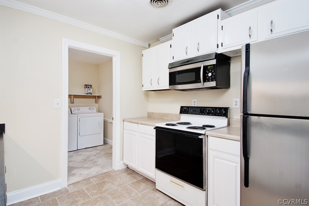 6412 Husting Road Chesterfield, VA 23832 - Photo 16 of 22 a kitchen with a stove microwave and refrigerator