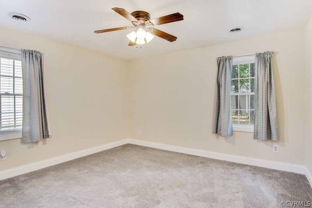 6412 Husting Road Chesterfield, VA 23832 - Photo 20 of 22 an empty room with windows and fan