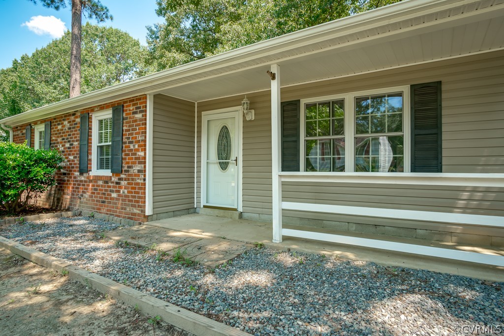 6412 Husting Road Chesterfield, VA 23832 - Photo 4 of 22 a view of a house with a small backyard
