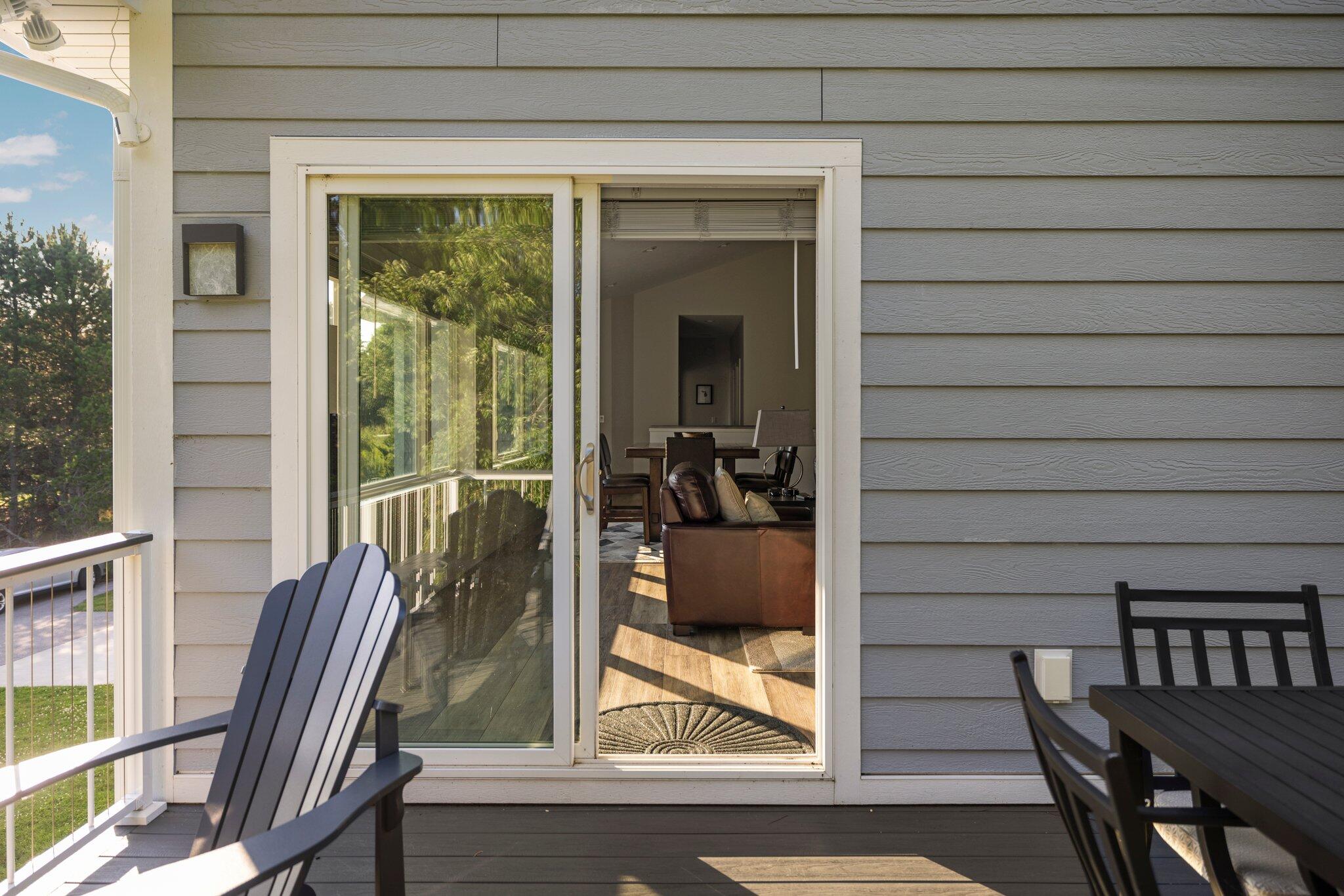 15241 Maxey Road Arcadia, MI 49613 - Photo 45 of 81 Slider door from living room to deck