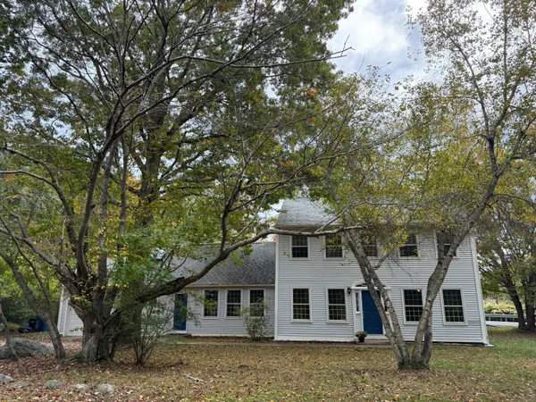 a front view of a house with a yard