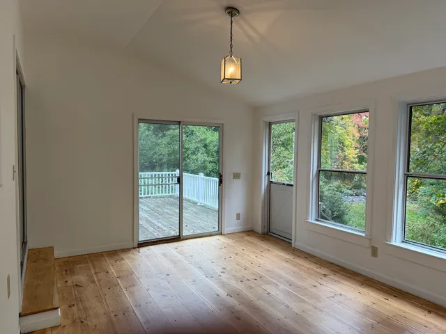 a view of a room with large windows